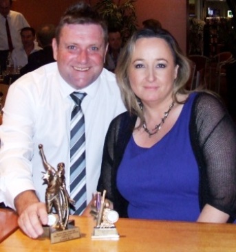 Among the trophies: James Holt with partner Katrina with Holtie's Fifths bowling award and his 50-game milestone trophy.