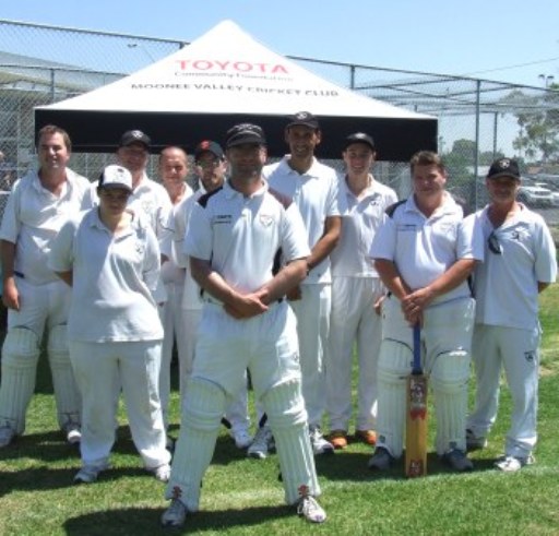 150-game player Michael Cumbo stands in front of Moonee Valley's Toyota marquee with teammates (from left) Simon Payton, Jessie Taylor, Doug Cumming, Peter Smith, Aidan O'Connor, Shane Esmore, Stephen Esmore, Mark Gauci and Jeff Nicol.