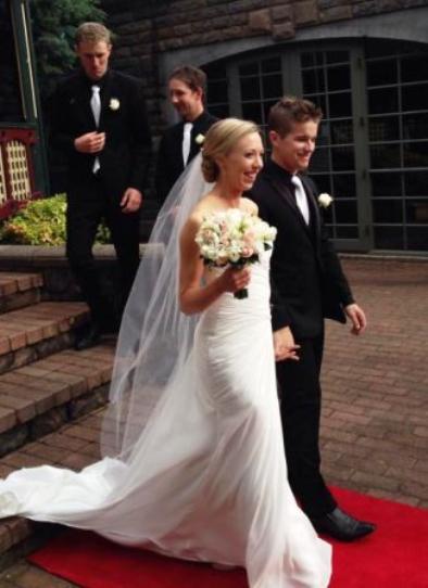 Valley's Stephen Ward leads bride Fiona down the red carpet, with MVCC teammates Sam Bishop and Ben Thomas behind.