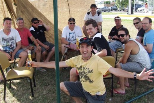 Sheltering in the hessian grandstand: L-R: Jim McKenzie, Dave Hutchison, Mark Gauci, Darren Nagle, Jim Polonidis (front), Jesse Nankivell-Sandor, Peter O'Kane (back), Sean O'Kane, Murray Walker, George Loh and Mick Cumbo.