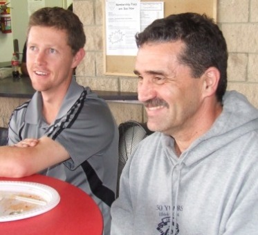 Caught out, Prids! Craig Pridham (left) was caught watching the Test action on TV, while Tony Gleeson is clearly running his eye over the form of our Thirds on the oval outside.