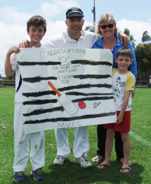 John  Talone got his own personal banner for the match - holding it here with sons Luke (left) and Max and wife Jodie.