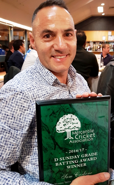 Sam Carbone is pictured with his Batting Award trophy.