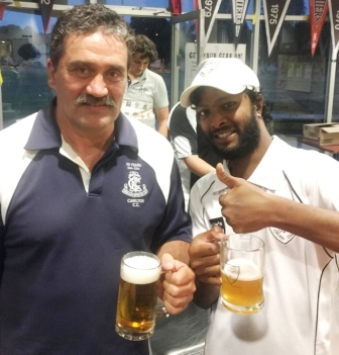 Tony Gleeson (left) and Clyde D'Cruz with their celebratory mugs.