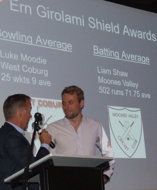 Liam Shaw's name is up in lights as he receives his batting award from Carlton Football Club media manager Ian Coutts.