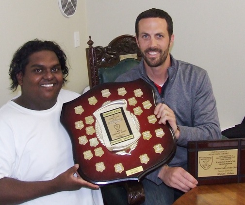 Michael Ozbun (right) receives his Lindsay Jones Best Clubman trophy from the previous season's winner, Channa DeSilva.