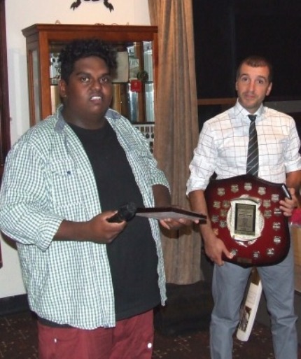 Channa DeSilva gives his acceptance speech for the Best Clubman award, while his skipper Jim Polonidis holds the shield.