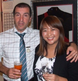 Jim likes the backdrop: An Essendon jumper! Jim & Tien Polonidis.