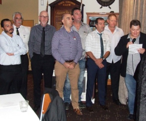 Life members gather on stage: L-R Dan Terzini, Charlie Walker, Kevin Gardiner, John Talone, Jim McKenzie, Jim Polonidis, Darren Nagle and Mark Gauci.