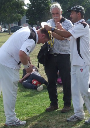 Well done, VP! Simon Thornton gets his premiership reward from skipper Jim Polonidis, watched by Prez Charlie Walker.