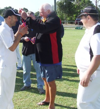 You guessed it! North West legend Ralph Barron presents a Barron Shield premiership medallion to Sam Carbone.