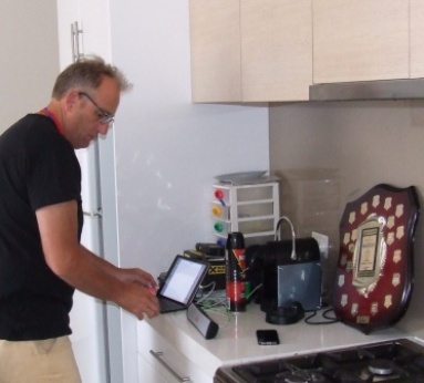 Dedicated correspondent Brett Curran writes the Grand Final match report on Sean O'Kane's kitchen benchtop - with Sean's 2013/14 Lindsay Jones Award shield providing extra inspiration.