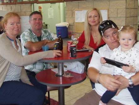 Celebrating the lead-up to Christmas at our party. L-R Kelly and Norm Wright, Vanessa Schuller and Mark Gauci with Marley.