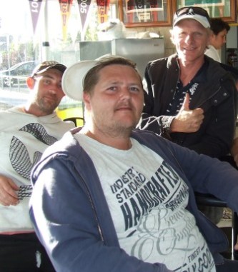 At right: New Moonee Valley players (from left) Matthew Houston and Dwayne Arrowsmith with past umpire Paul Larkins.