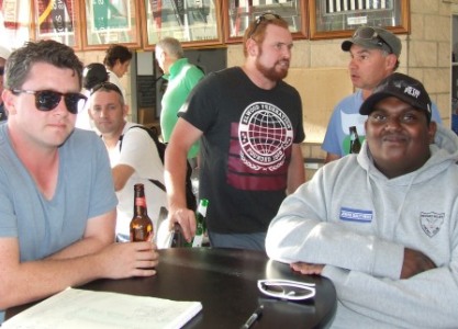 Celebrating Christmas: (L-R) Nate Wolland and Dean Jukic have a chat behind Ed Rayner and Channa DeSilva.