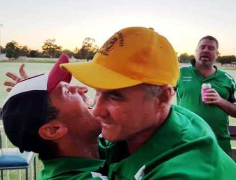 A hug for a mate as the sun rises: Jim Polonidis (left) and Sean O'Kane, with Norm Wright waiting behind.