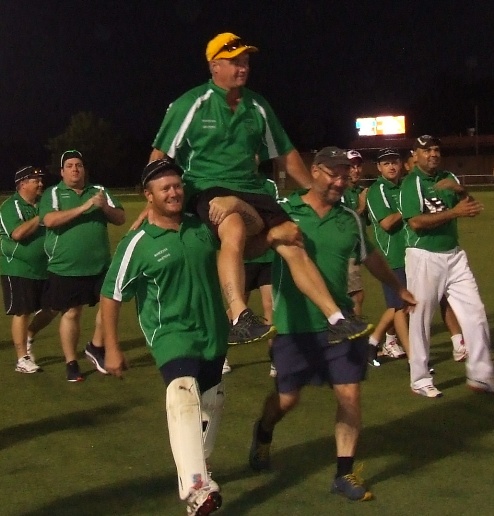 Chaired off after the win, and with a wicket in his last over. Sean O'Kane with his brothers Peter (left) and Mark.