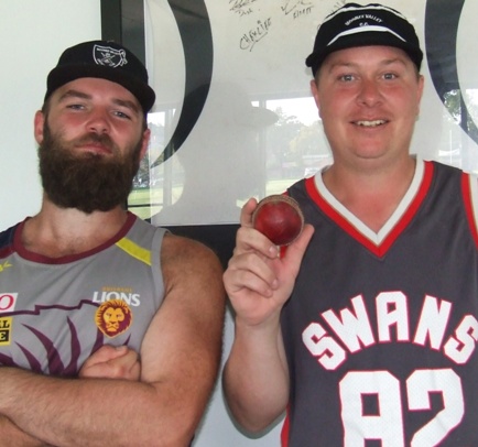 Mitchell Britton with his five-wicket ball and great mate Markus Harris.