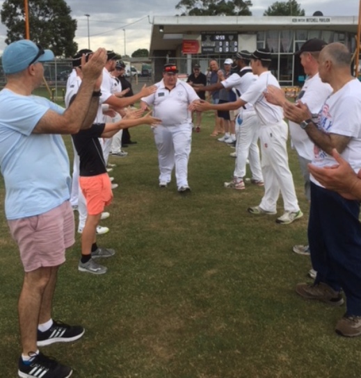 Mark Gauci gets a guard of honor as he makes his way onto Ormond Park for his 300th game, including fellow 300-gamers John Talone (front left) and Joe Ansaldo (front right).