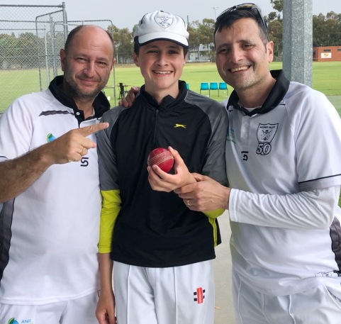 Noah Nimorakiotakis shows off his hat-trick ball, with teammate George Manousos (left) and dad/captain Bill.