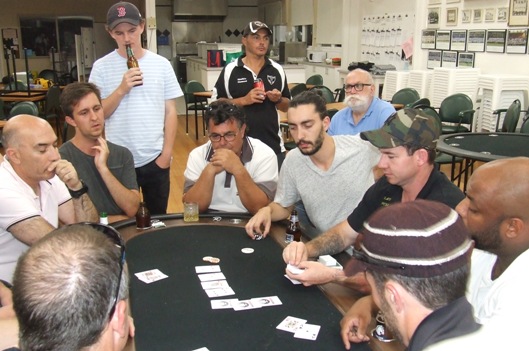 Intense interest around and behind the final table. Clockwise from left: John Talone, Paddy Shelton, Charles Bibby, Mick Intagliata, Danny Terzini, Daniel McKenzie, Michael Felle, event organiser Kav, Manu Poulose and Michael Ozbun.