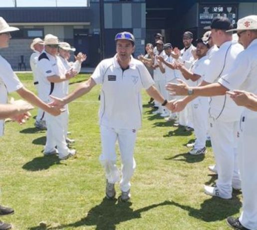 Moonee Valley great Jim Polonidis runs onto the ground through a guard of honor of teammates and clubmates.