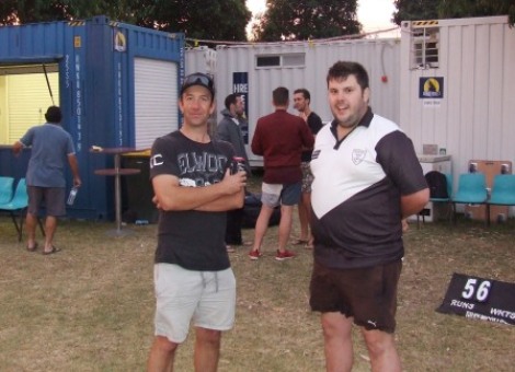 Outdoors - with the Blue Bar in the background. Ben Thomas (left) talks tactics with Shane Chalmers.