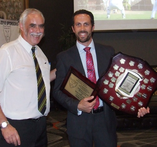 Great clubman Michael Ozbun (right) receives his Lindsay Jones award from President Charlie Walker.