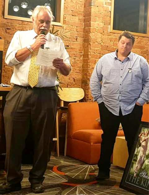 President Charlie Walker reads the citation for Mark Gauci's Lindsay Jones Award.