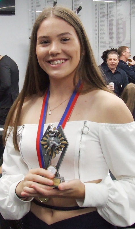 Tara Newman with her Most Improved Player award - and her Premiership medallion.