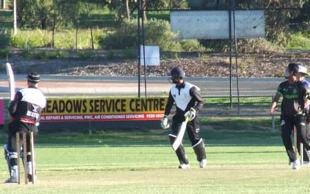 Lou Raffaele dispatches a ball to the boundary, watched by batting partner Chanaka Silva.