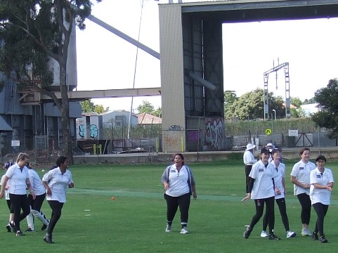 It's just sunk in: The girls out on the ground as they realise they've won the Grand Final.