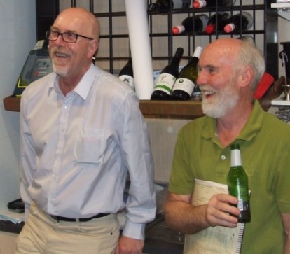 Enjoying themselves behind the bar: Committee members Kevin Gardiner (left) and Allan Cumming.