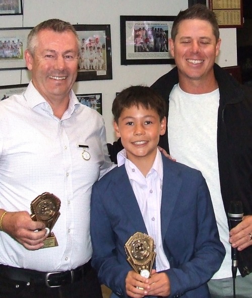 Geoff McKeown and son Ollie were joint winners of the Seconds fielding award. They received their trophies from captain Nathan Waites (far right).