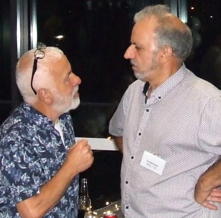 Making a point: Tony Coco (left) and John Bentivoglio talk about a match.