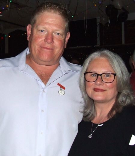 A lot to be proud about: Team of the Half Century member Darren Nagle with partner Kim Simmons - the mum of Jack and Tara Newman - captains of our First Eleven and our Women's team.