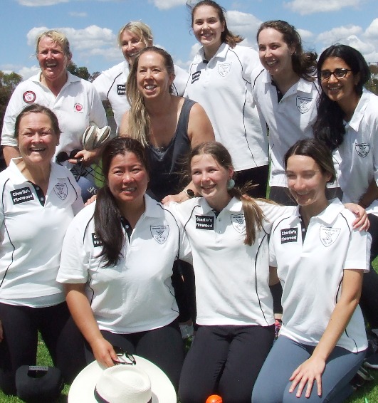 The winning team gets around hat-trick taker Katherine Baker at Ormond Park. L-R: Back - Adele Walker, Dianna Dullard, co-coach Sarah Gooden, Tara Newman, Sarah Fenn and Pari Tuli. Front - Kylie Maxwell, Luisa Liong, Katherine Baker and Lane Edwards.