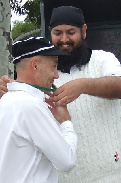 Fourth Valley flag for Sam Carbone - getting his medal from captain Manu Singh.