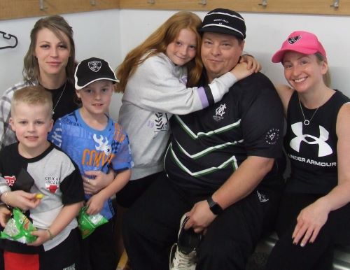 Mark Gauci and his family: With daughter Brooke (left) with her sons Jaxson and Kaleb, and with daughter Marley and partner Vanessa.