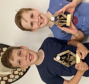 Jeremy and Luke Sevenson with their awards.