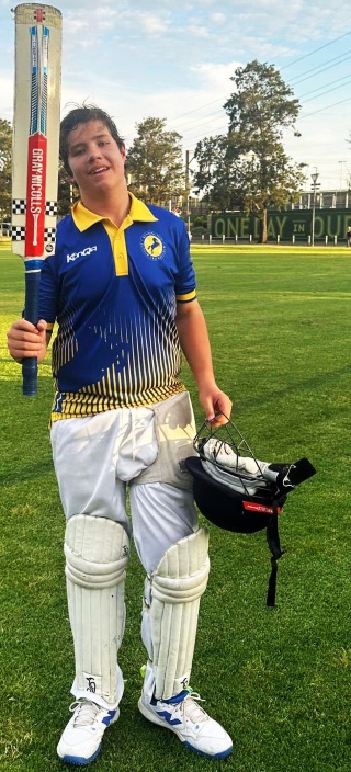 David Lubansky raises the bat after his maiden century for Moonee Valley.