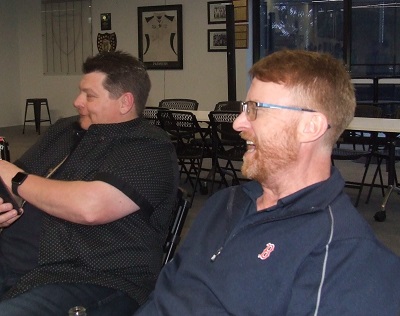 A chance to relax after preparing the brisket: Dean Lawson (front) with Mark Gauci.