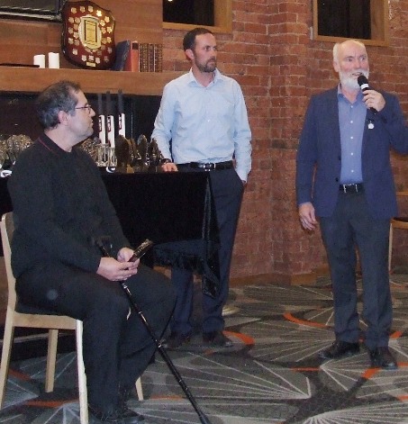 Committee members Brendan Rhodes (left) and Michael Ozbun listen as Sixths captain Allan Cumming talks about his season.