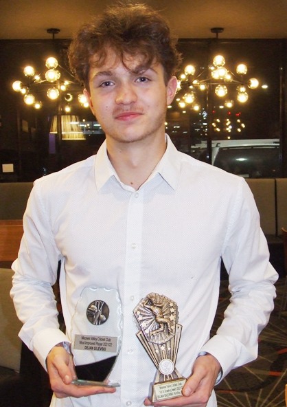 Dejan Gilevski shows off his two trophies - the Most Improved Player award and the First Eleven bowling trophy.