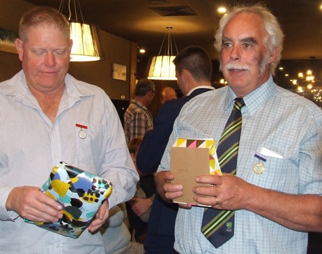 Women's team co-coaches Darren Nagle (left) and Charlie Walker received gifts for their support.