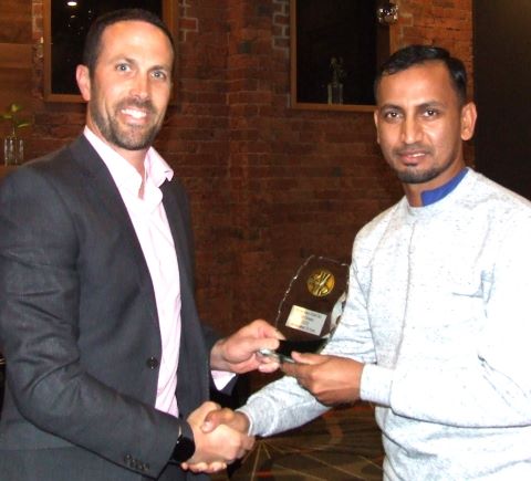 Executive Member Michael Ozbun (left) presents Salman Afridi with his Club Champion award.