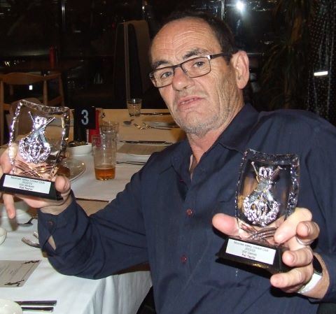 Newly-inducted Life Member Pat Taylor shows there's still plenty of on-field action - with his trophies.