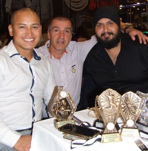 A table of trophies: L-R Sean O'Kane Award winner Chand Shrestha with Jim Polonidis and Manu Singh.