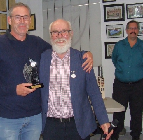 James Smith (left) receives his batting award from Fifths captain Allan Cumming, with MC Brendan "Jonty" Rhodes looking on.