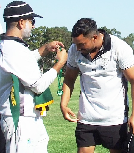 A premiership medallion for Vinnie Singh - from skipper Sunny Sharma.